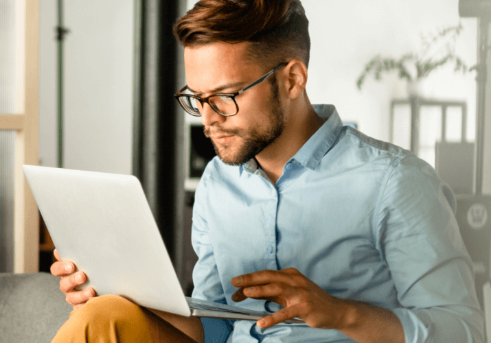 a young men wearing glasses talking to an allergist online