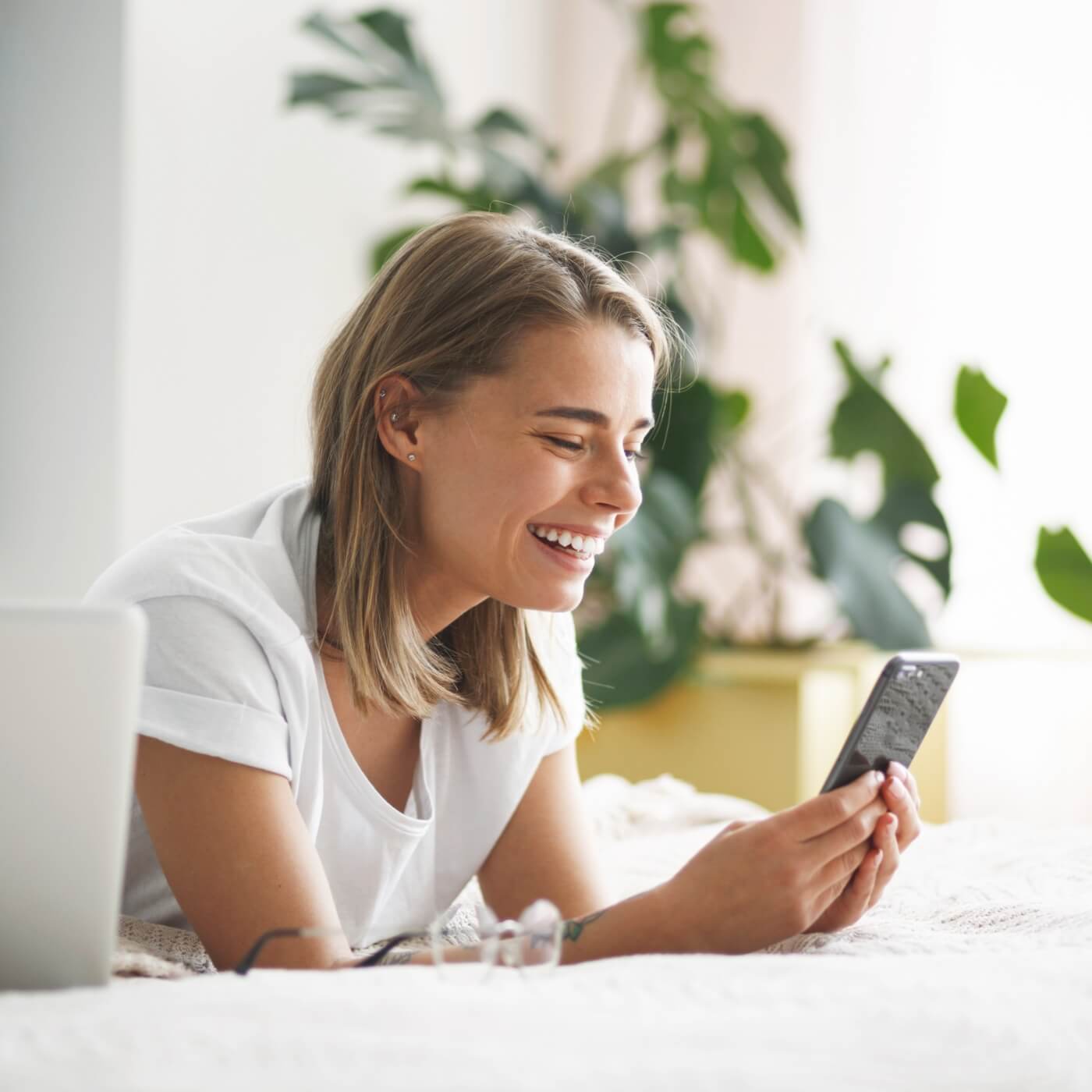 A woman booking an online consultation on her mobile phone