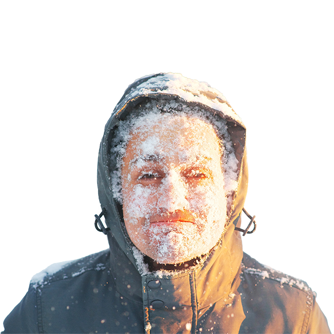 A man wearing a coat during winter with frost on his face