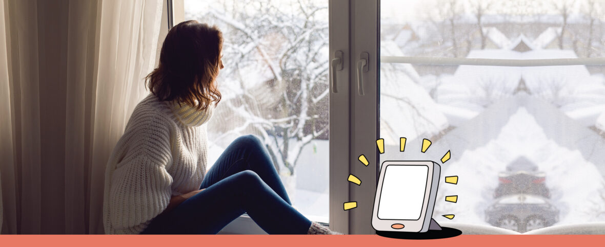 Woman looking out of window, illustrated iPad in foreground.