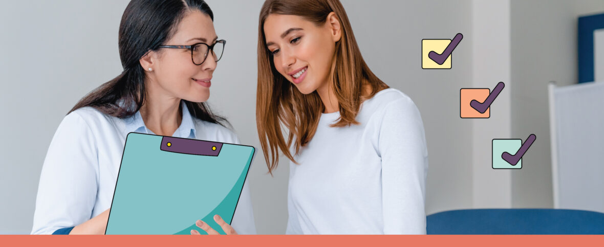 Woman getting a checkup from a female doctor, who's holding a clipboard and discussing the patient's test results.