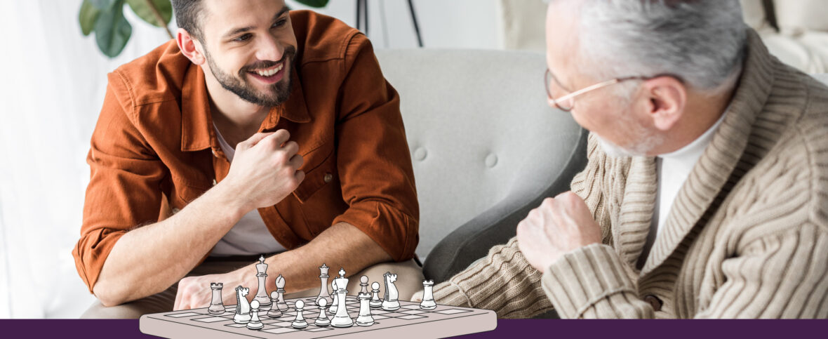 Young man and older man playing chess, looking happy due to their awesome cognitive skills.