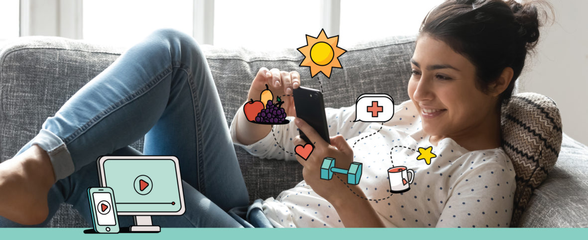 Woman laying back on her couch, speaking to a doctor on her cellphone and smiling.