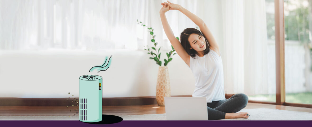 Woman doing a side stretch with an air purifier in the foreground.