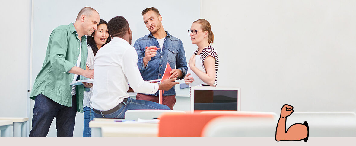 a group of 5 people talking in a boardroom