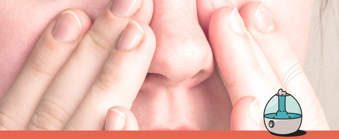 Close-up of a person with sinusitis touching their nose. An illustration of a humidifier is in the corner.