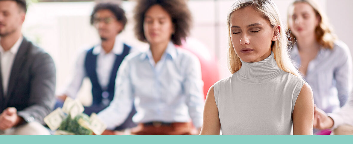 A group of employees meditating