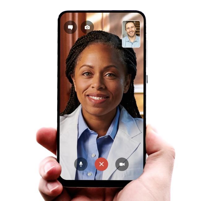 A hand holding a mobile device showing a doctor via facetime
