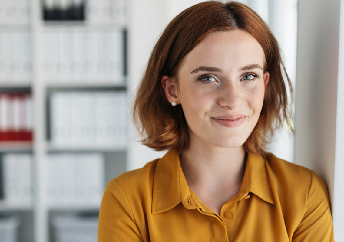 woman-by-office-window-content woman-by-office-window-content